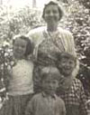 Mother Isla at Snowdrop Cottage with my cousins Sheila and Jimmy and at the front my brother Ian. 